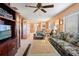 Comfortable living room featuring floral sofas, a large coffee table, and ample natural light at 8019 Feather Ct # C, Hudson, FL 34667