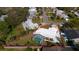 Aerial view highlighting home, pool, and large backyard at 13632 Imperial Groves S Dr, Largo, FL 33774