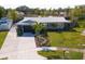 Aerial view showcasing home's curb appeal and yard at 13632 Imperial Groves S Dr, Largo, FL 33774