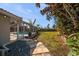 Landscaped backyard with stone pathway and pool at 13632 Imperial Groves S Dr, Largo, FL 33774