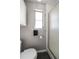 Clean bathroom with shower, toilet and small window at 13632 Imperial Groves S Dr, Largo, FL 33774