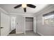 Bedroom with carpet flooring, ceiling fan, and closet at 13632 Imperial Groves S Dr, Largo, FL 33774