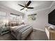 Spacious bedroom with ample natural light and ceiling fan at 13632 Imperial Groves S Dr, Largo, FL 33774