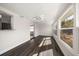 Bright dining room with dark hardwood floors and large windows at 13632 Imperial Groves S Dr, Largo, FL 33774