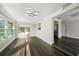 Open dining room with hardwood floors and kitchen access at 13632 Imperial Groves S Dr, Largo, FL 33774
