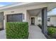 Front entrance of a renovated home with modern design elements at 13632 Imperial Groves S Dr, Largo, FL 33774