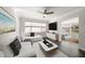 Bright living room with comfortable seating and large windows at 13632 Imperial Groves S Dr, Largo, FL 33774