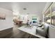 Open concept living and dining area with hardwood floors and natural light at 13632 Imperial Groves S Dr, Largo, FL 33774