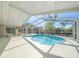 Spacious pool and patio area with screened enclosure at 13632 Imperial Groves S Dr, Largo, FL 33774