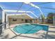 Inviting screened pool area with large pool and patio at 13632 Imperial Groves S Dr, Largo, FL 33774