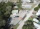 Aerial view of a commercial lot with a large metal building and ample space for trucks and equipment at 14921 Diagonal Rd, Hudson, FL 34667