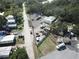 Aerial view of a commercial lot with a large metal building and ample space for trucks and equipment at 14921 Diagonal Rd, Hudson, FL 34667