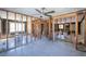 Under renovation living room with exposed framing and new flooring at 17726 Long Point Dr, Redington Shores, FL 33708