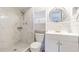 Updated bathroom with white cabinets and marble shower at 1900 68Th N St # 301, St Petersburg, FL 33710