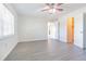 Spacious bedroom with wood-look floors and ceiling fan at 1900 68Th N St # 301, St Petersburg, FL 33710