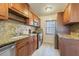 Updated kitchen featuring granite countertops and wood cabinets at 1900 68Th N St # 301, St Petersburg, FL 33710