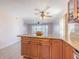 Kitchen island with granite countertop and wood cabinets at 1900 68Th N St # 301, St Petersburg, FL 33710