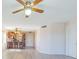 Bright living room with ceiling fan and laminate flooring at 1900 68Th N St # 301, St Petersburg, FL 33710