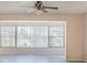 Living room with large windows and ceiling fan at 1900 68Th N St # 301, St Petersburg, FL 33710