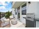 Relaxing patio with seating, a grill, and a concrete floor at 2021 Amelia Bay Pl, Valrico, FL 33596
