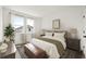 Cozy bedroom with a king-size bed, wood nightstands, and a large window at 2021 Amelia Bay Pl, Valrico, FL 33596