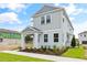 Two-story light gray home with landscaping at 2021 Amelia Bay Pl, Valrico, FL 33596