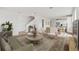 Open-concept living room with hardwood floors, modern decor, and ample natural light at 2021 Amelia Bay Pl, Valrico, FL 33596