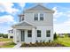 Two-story light gray home with landscaping at 2021 Amelia Bay Pl, Valrico, FL 33596