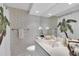 Clean bathroom with updated vanity and tropical-themed shower curtain at 4575 Cove Cir # 202, St Petersburg, FL 33708