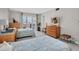 Spacious bedroom with twin beds and ample storage, featuring an outdoor view at 4575 Cove Cir # 202, St Petersburg, FL 33708