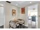 Small breakfast nook with glass table and chairs at 4575 Cove Cir # 202, St Petersburg, FL 33708