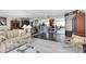 Reflective dining room with glass table, modern chairs, and mirrored walls at 4575 Cove Cir # 202, St Petersburg, FL 33708