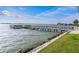 Long wooden dock stretching over calm water at 4575 Cove Cir # 202, St Petersburg, FL 33708