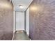 Apartment entryway with patterned wallpaper at 4575 Cove Cir # 202, St Petersburg, FL 33708