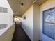 Building hallway with carpeted floor and doors at 4575 Cove Cir # 202, St Petersburg, FL 33708