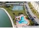 Community pool with surrounding lounge chairs at 4575 Cove Cir # 202, St Petersburg, FL 33708