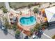 Relaxing kidney-shaped pool with people swimming at 4575 Cove Cir # 202, St Petersburg, FL 33708