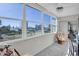 Sunroom with ample natural light and stunning water views at 4575 Cove Cir # 202, St Petersburg, FL 33708