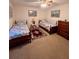 Bedroom with two twin beds, a dresser and carpet flooring at 4660 Marine Pkwy # 202, New Port Richey, FL 34652