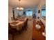 Spacious dining area with view to living room and balcony at 4660 Marine Pkwy # 202, New Port Richey, FL 34652
