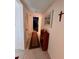 Bright hallway with wood shelving, carpet runner, and neutral walls at 4660 Marine Pkwy # 202, New Port Richey, FL 34652