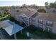 Aerial view of condo building with parking at 4805 Sunnybrook Dr # 21, New Port Richey, FL 34653