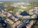 Community overview with pond and pool at 4805 Sunnybrook Dr # 21, New Port Richey, FL 34653
