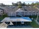 Exterior shot of the two-story apartment building with covered parking and well-maintained landscaping at 4805 Sunnybrook Dr # 21, New Port Richey, FL 34653