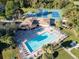 Aerial view of community pool, spa, tennis and pickle ball courts at 4805 Sunnybrook Dr # 21, New Port Richey, FL 34653