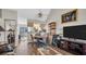 Cozy living room features wood floors and a view into the kitchen at 4805 Sunnybrook Dr # 21, New Port Richey, FL 34653