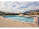Beautiful community pool with ample seating, shade and meticulously maintained brick deck at 502 Lime Tree Ct, Sun City Center, FL 33573