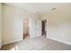 Bedroom with carpet, closet, and access to other rooms at 5825 1/2 S 5Th St, Tampa, FL 33611