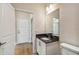 Modern bathroom with granite countertop and updated fixtures at 5825 1/2 S 5Th St, Tampa, FL 33611