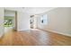 Dining room with hardwood floors, access to kitchen and backyard at 5825 1/2 S 5Th St, Tampa, FL 33611